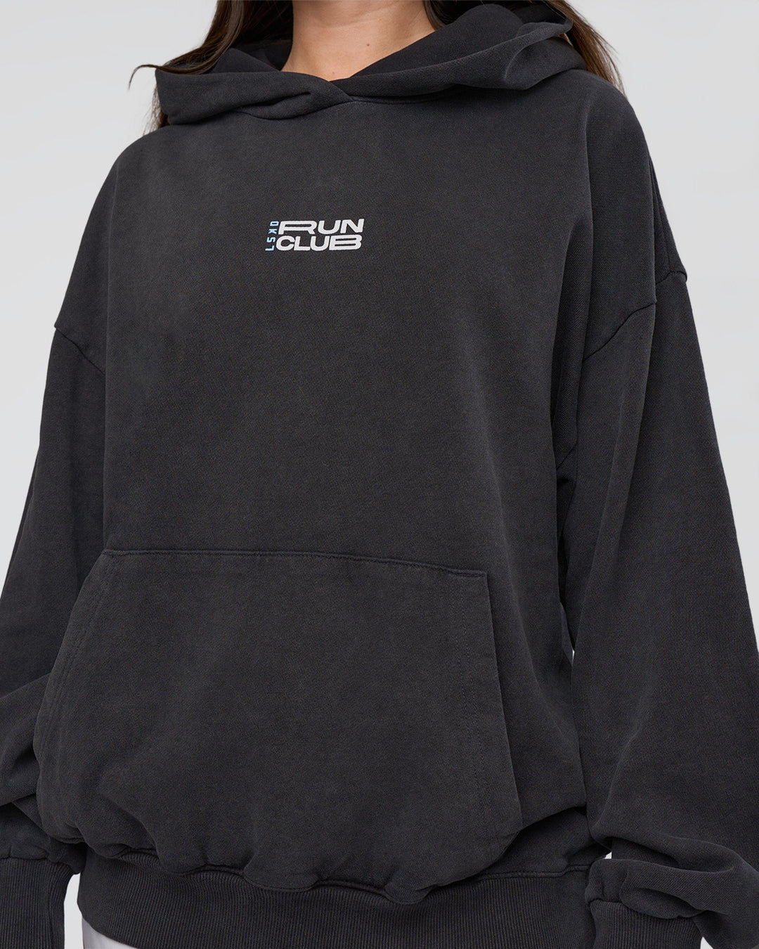 Woman wearing Runner’s Unisex Oversized Hoodie - Black Washed-White | Model:Estella | Size:XS