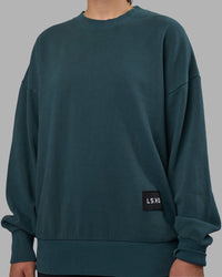 Woman wearing Segmented Oversized Sweater - Abyssal | Model:Charlize | Size:XS