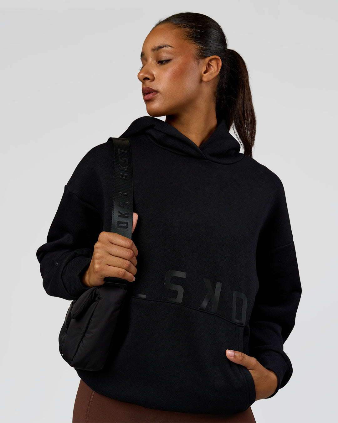 Woman wearing Shadow Mode Oversized Hoodie - Black | Model:Rosie | Size:XS - view 4