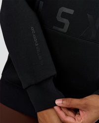 Woman wearing Shadow Mode Oversized Hoodie - Black | Model:Rosie | Size:XS | Thumbnail Index: 7
