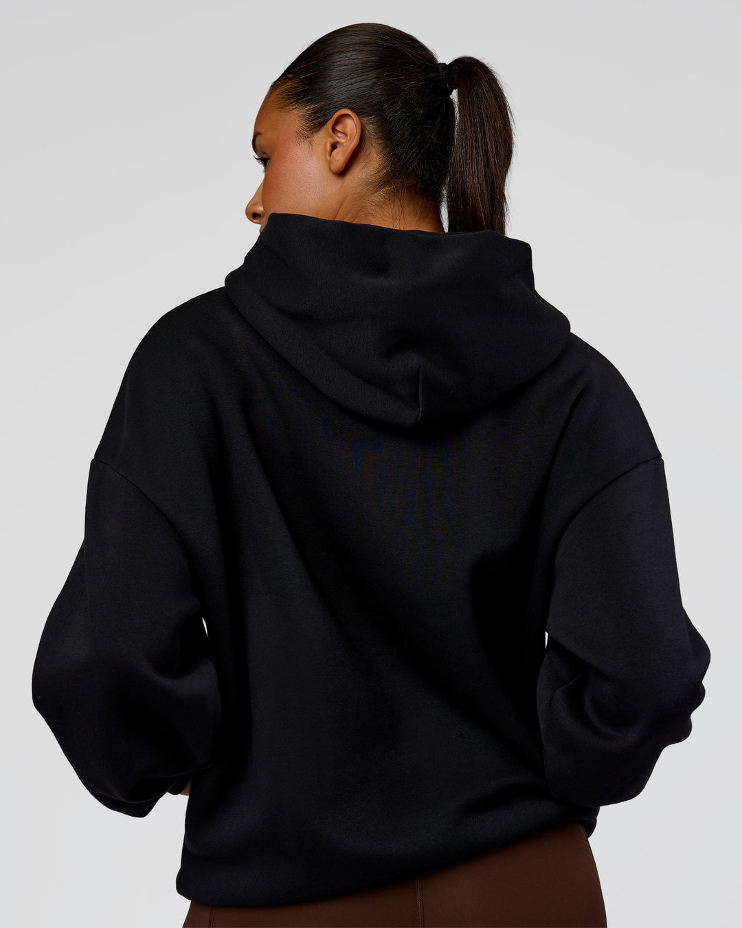 Woman wearing Shadow Mode Oversized Hoodie - Black | Model:Rosie | Size:XS - view 9