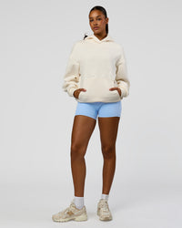 Woman wearing Shadow Mode Oversized Hoodie - Off White | Model:Rosie | Size:XS