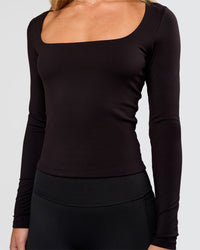 Woman wearing Show It Off Long Sleeve Top in Black | Model:Issy | Size:XS
