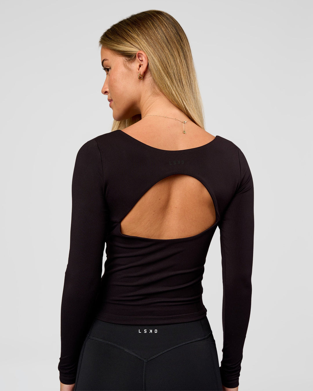 Woman wearing Show It Off Long Sleeve Top in Black | Model:Issy | Size:XS