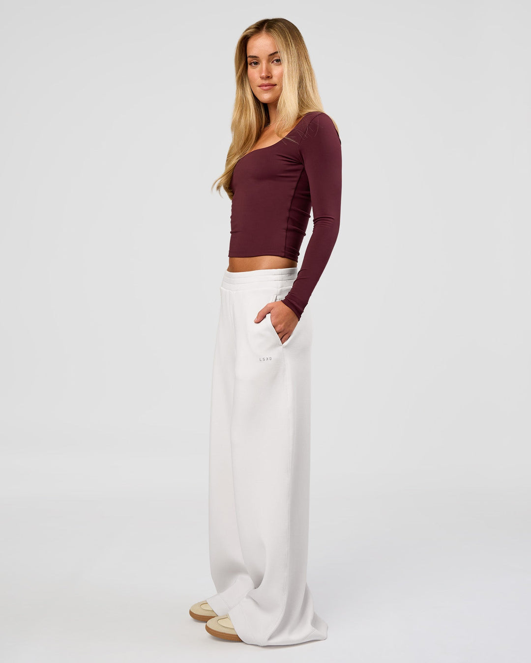 Woman wearing Show It Off Long Sleeve Top in Cherry Lacquer | Model:Issy | Size:XS