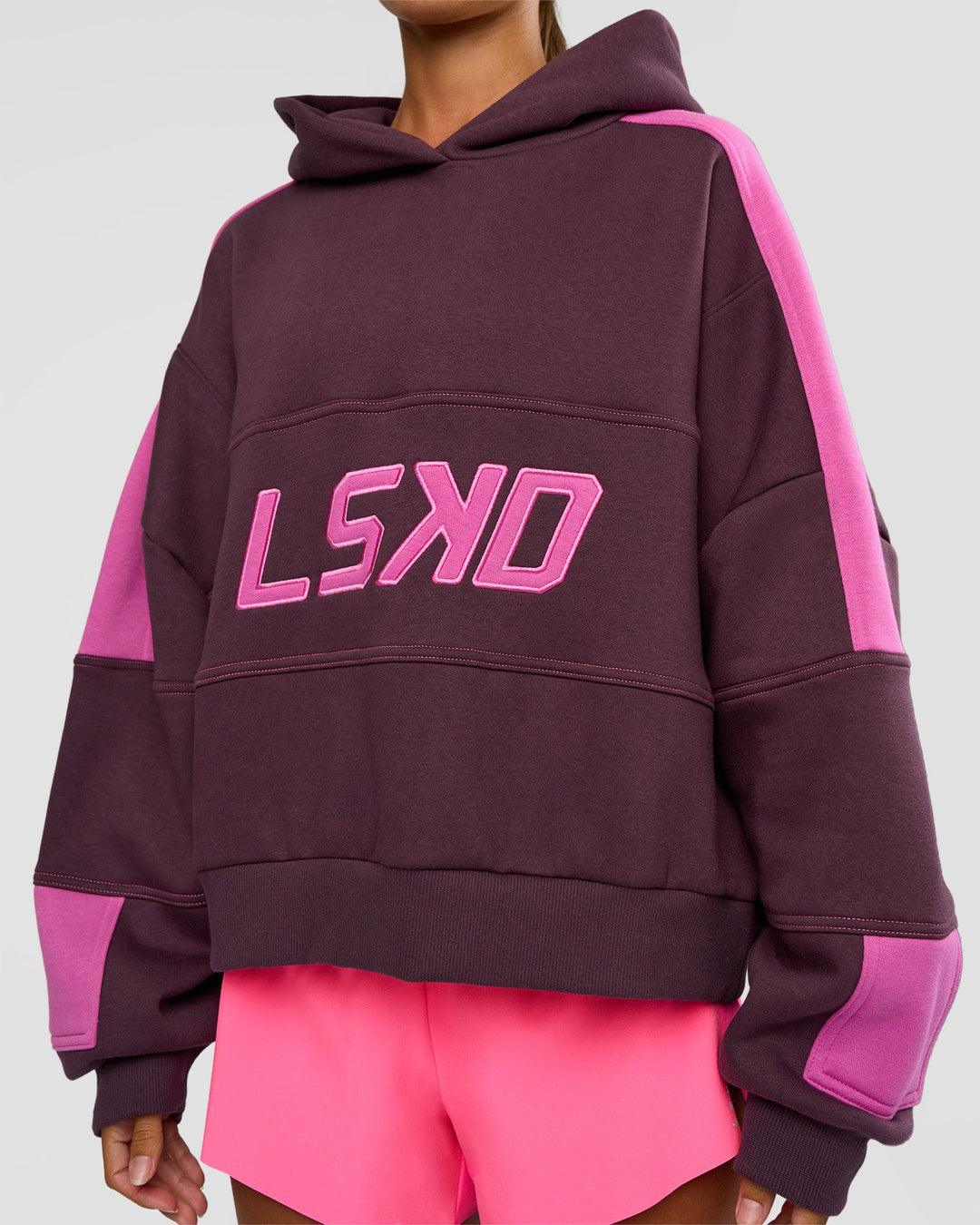 Woman wearing Slam Cropped Oversized Hoodie - Midnight Plum-Ultra Fuchsia | Model:Brylee | Size:XS