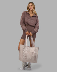 Woman wearing Slam Quarter Zip Sweater - Peppercorn | Model:Leilani | Size:XS