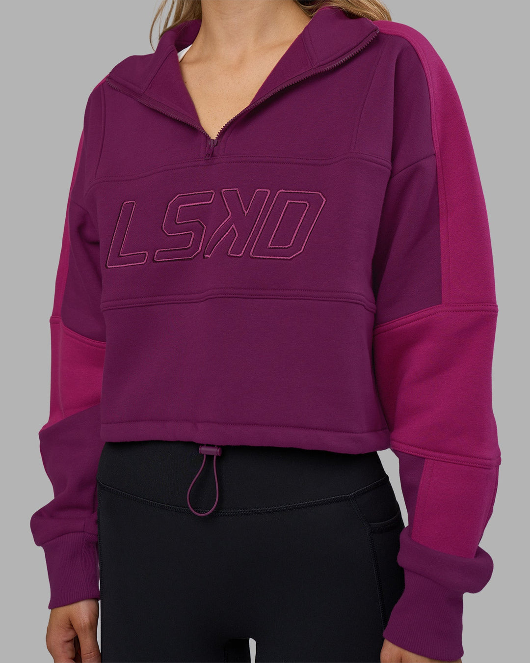 Woman wearing Slam Quarter Zip Sweater - Plum Caspia-Boysenberry | Model:Leilani | Size:XS
