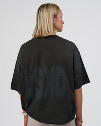 Woman wearing Spray Heavyweight Unisex Oversized Tee - Charcoal Washed | Model:Halle | Size:XS