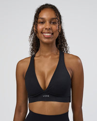 Woman wearing Stamina Sports Bra D/DD/E - Black | Model:Jordan | Size:XS | Thumbnail Index: 2