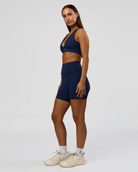 Woman wearing Stamina Sports Bra - Future Navy | Model:Brylee | Size:XS