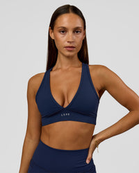 Woman wearing Stamina Sports Bra - Future Navy | Model:Brylee | Size:XS