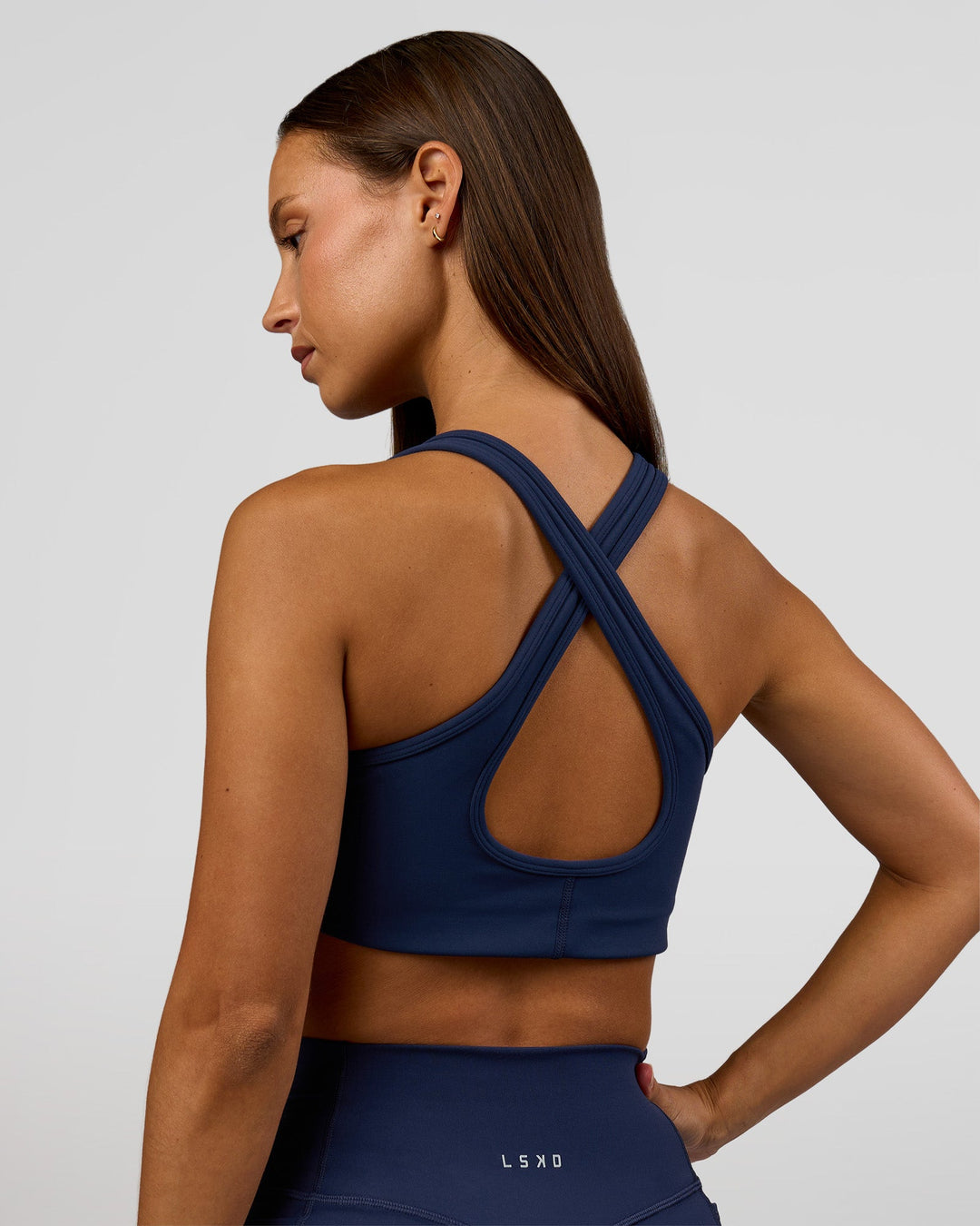 Woman wearing Stamina Sports Bra - Future Navy | Model:Brylee | Size:XS