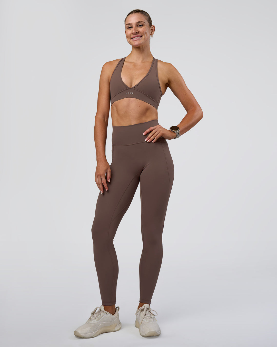 Woman wearing Stamina Sports Bra - Peppercorn | Model:Emelia | Size:XS