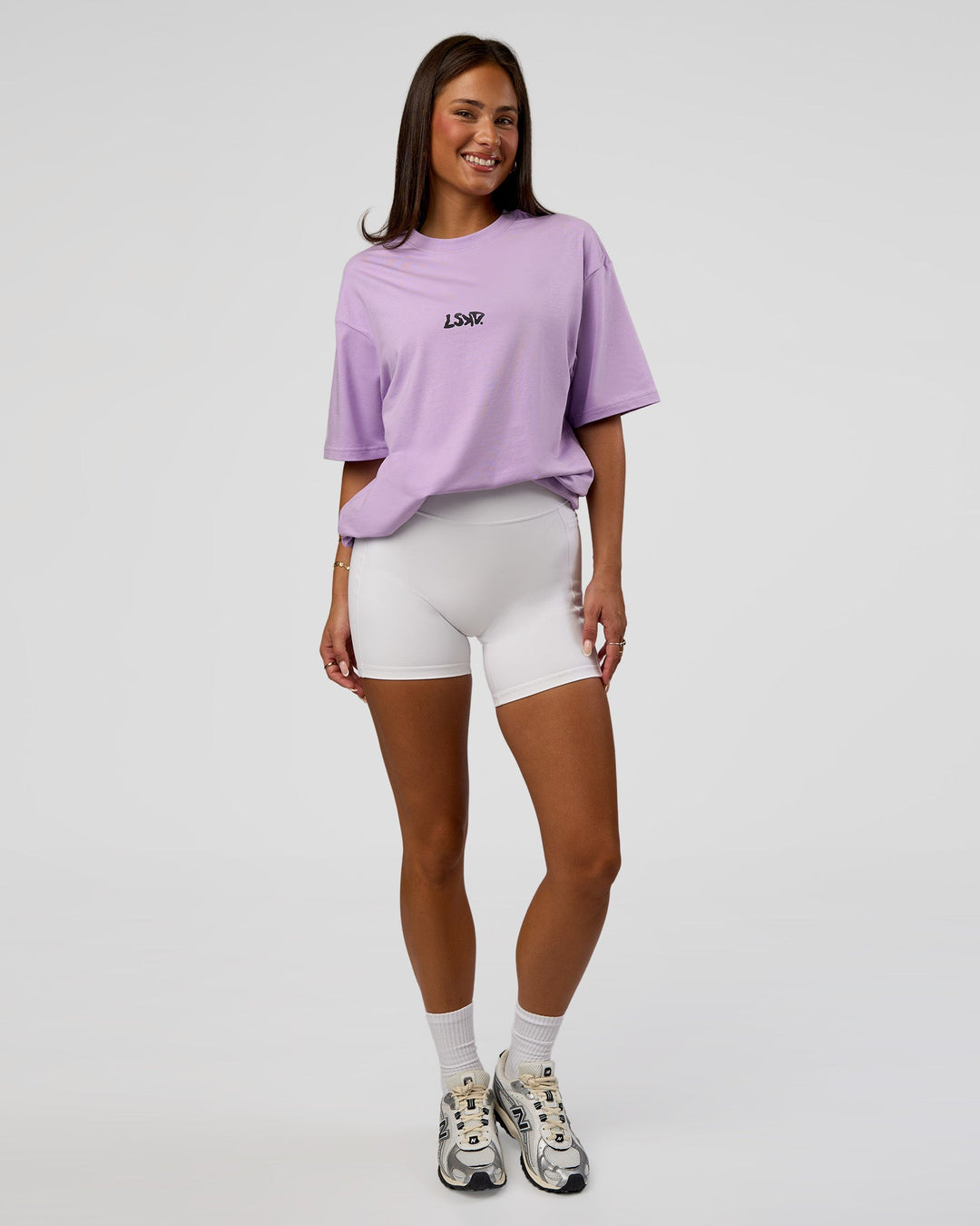 Woman wearing Standard Issue FLXCotton Oversized Tee - Pale Lilac-Black | Model:Bianca | Size:XS