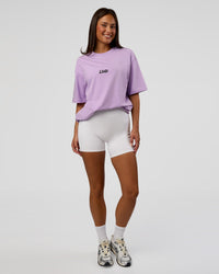 Woman wearing Standard Issue FLXCotton Oversized Tee - Pale Lilac-Black | Model:Bianca | Size:XS