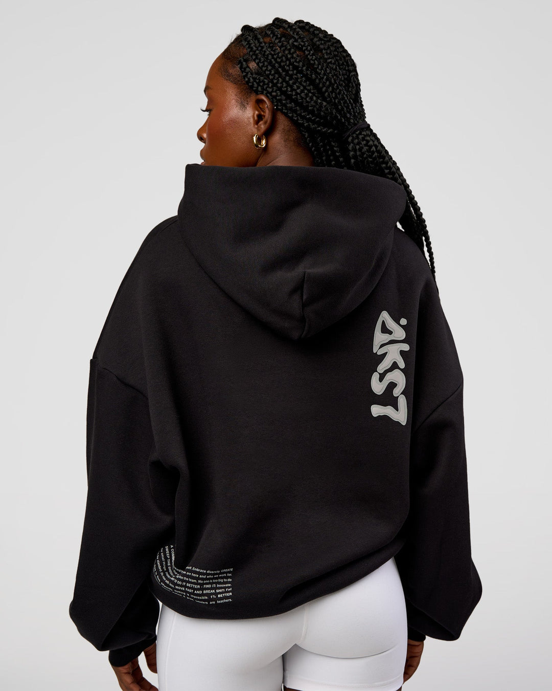 Woman wearing Static Grit Unisex Boxy Hoodie - Black-Alloy | Model:Ellie | Size:XS