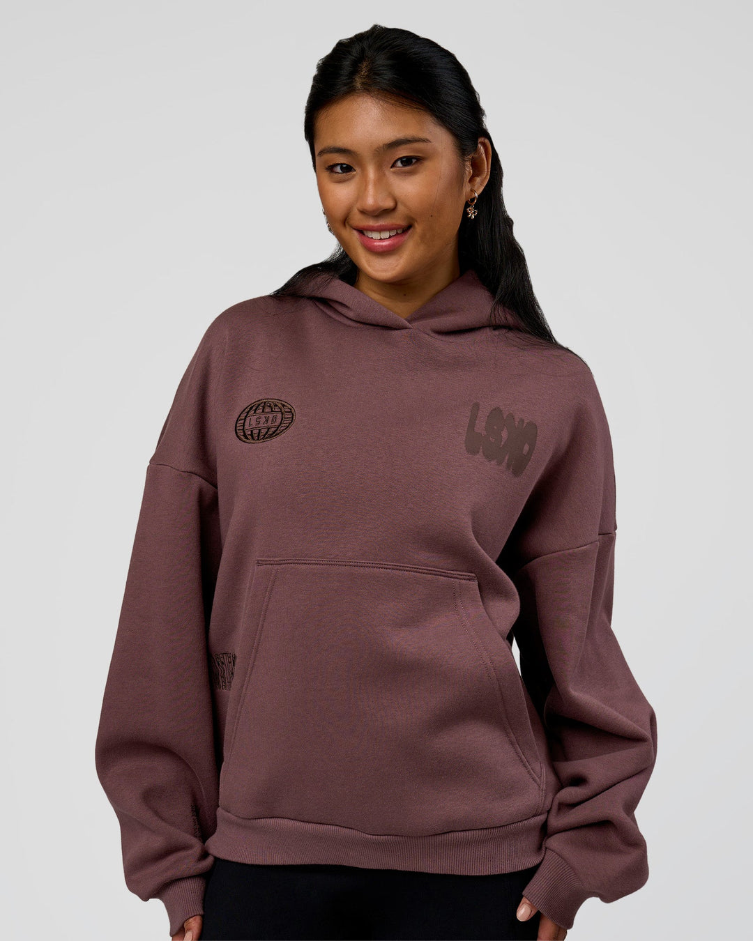 Woman wearing Static Grit Unisex Boxy Hoodie - Cocoa Powder-Hot Chocolate | Model:Loren | Size:XS