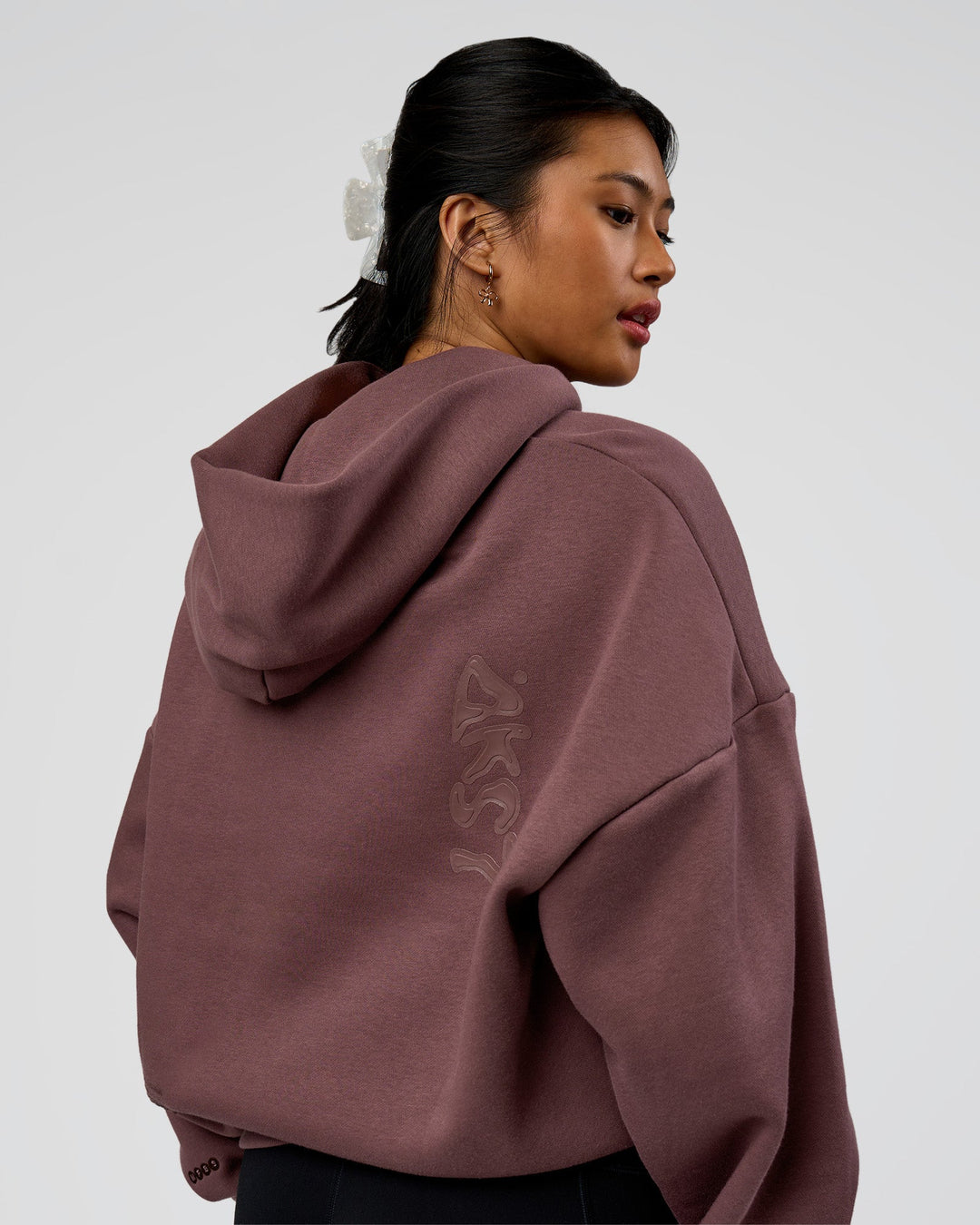 Woman wearing Static Grit Unisex Boxy Hoodie - Cocoa Powder-Hot Chocolate | Model:Loren | Size:XS