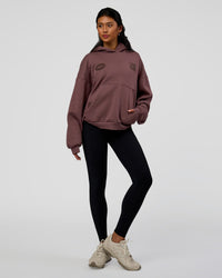Woman wearing Static Grit Unisex Boxy Hoodie - Cocoa Powder-Hot Chocolate | Model:Loren | Size:XS