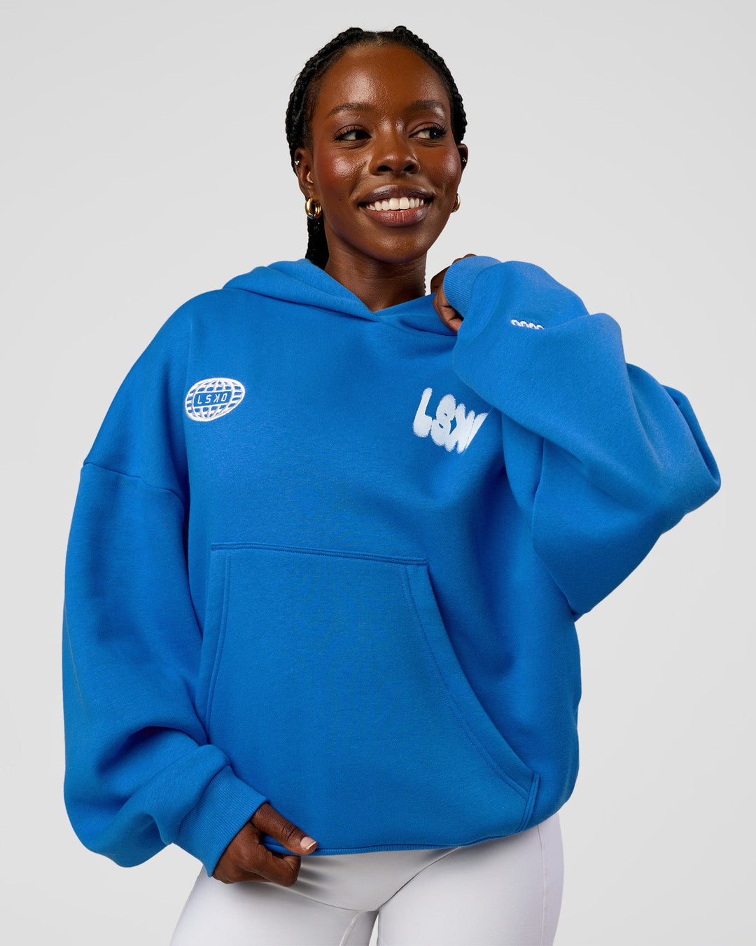 Woman wearing Static Grit Unisex Boxy Hoodie - Palace Blue-White | Model:Ellie | Size:XS