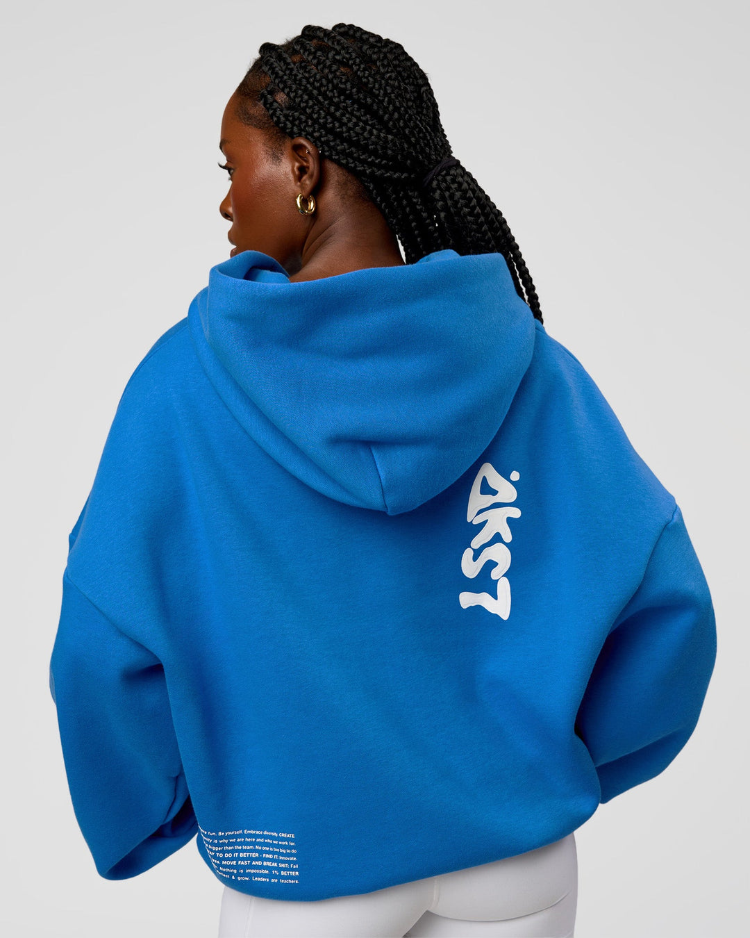 Woman wearing Static Grit Unisex Boxy Hoodie - Palace Blue-White | Model:Ellie | Size:XS