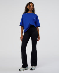 Woman wearing Sticker Heavyweight Oversized Tee - Electric Indigo-Baltic Sea | Model:Jordan | Size:XS