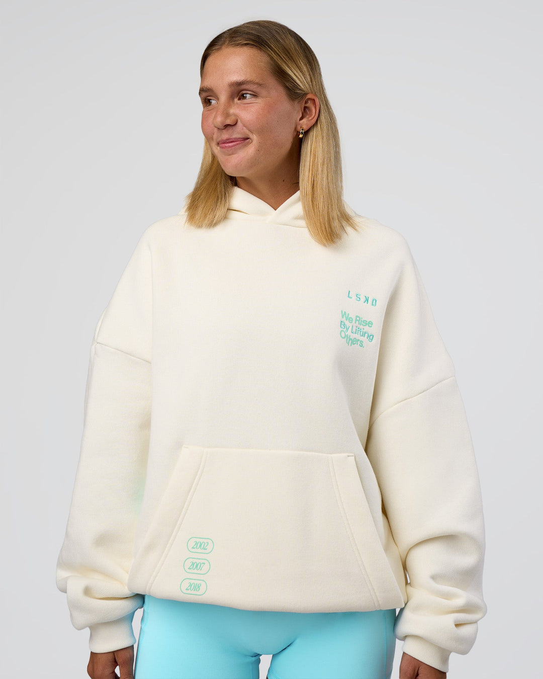 Woman wearing Sticker Unisex Oversized Hoodie - Off White-Jelly Mint | Model:Amity | Size:XS