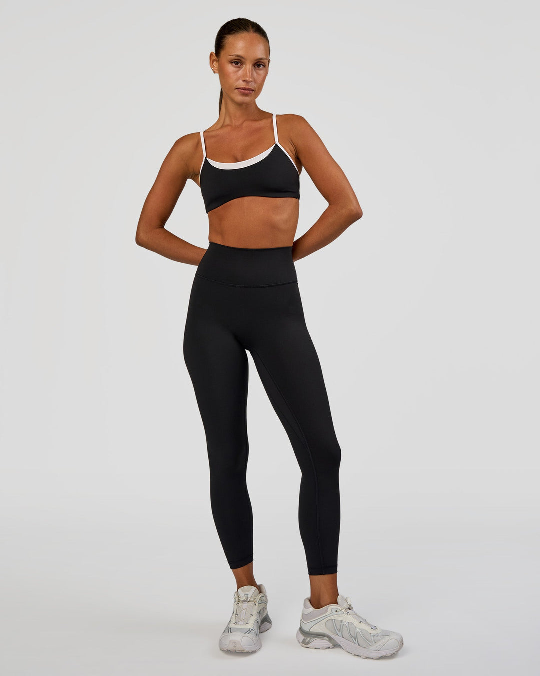 Woman wearing Tempo Sports Bra - Black-White | Model:Brylee | Size:XS