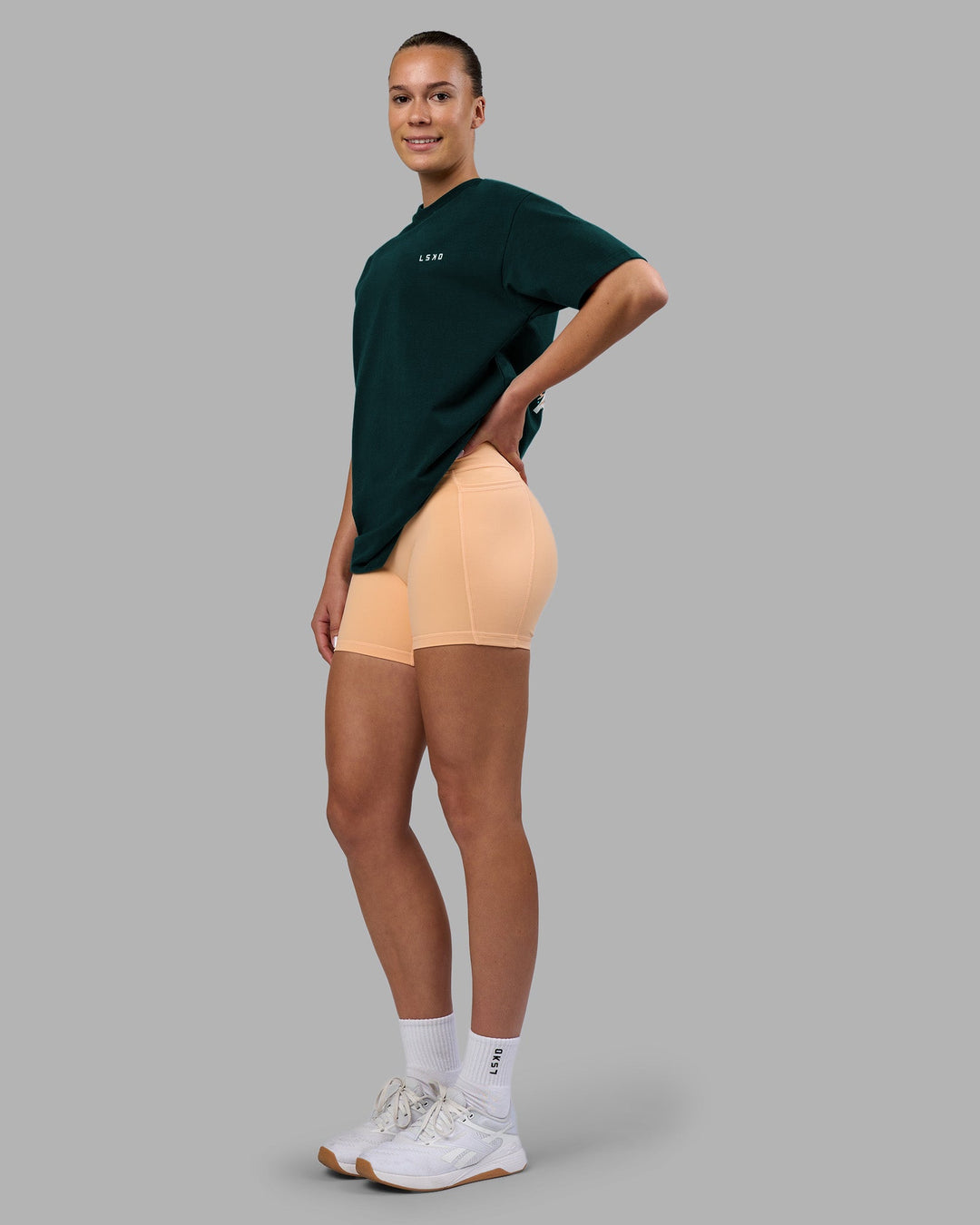 Woman wearing Think Strong Heavyweight FLXCotton Tee Oversize - Dark Moss-Off White | Model:Charlize | Size:XS