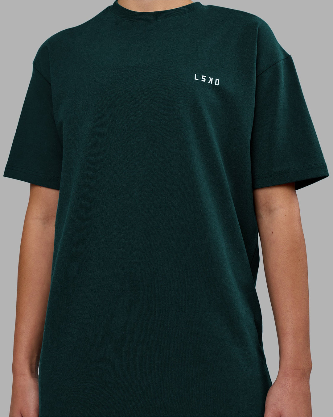 Woman wearing Think Strong Heavyweight FLXCotton Tee Oversize - Dark Moss-Off White | Model:Charlize | Size:XS