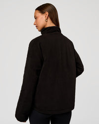 Woman wearing Thrive Reversible Jacket - Black | Model:Brylee | Size:XS