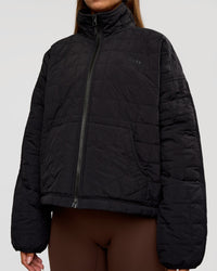 Woman wearing Thrive Reversible Jacket - Black | Model:Brylee | Size:XS