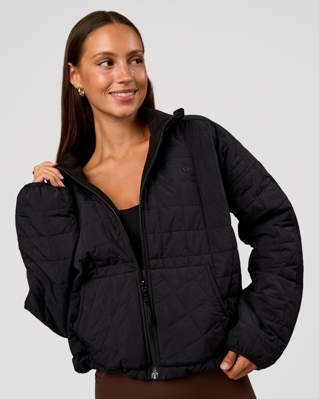 Woman wearing Thrive Reversible Jacket - Black | Model:Brylee | Size:XS