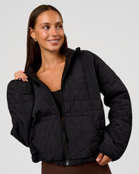 Woman wearing Thrive Reversible Jacket - Black | Model:Brylee | Size:XS