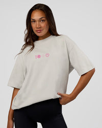 Woman wearing Trust The Process Heavyweight Unisex Oversized Tee - Digital Mist-Ultra Pink | Model:Kirstyn | Size:XS