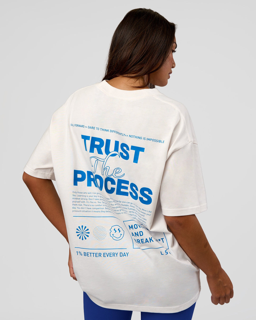 Woman wearing Trust The Process Heavyweight Unisex Oversized Tee - Off White-Electric Indigo | Model:Kirstyn | Size:XS