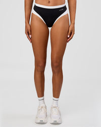 Woman wearing Turbo Track Brief in Black-White| Model:Txai | Size:XS