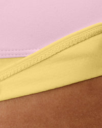 Woman wearing Turbo Track Brief in Marshmallow-Lemon | Model:Txai | Size:XS