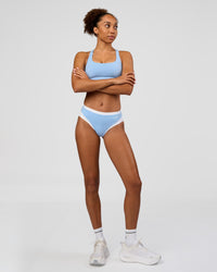 Woman wearing Turbo Track Brief in Open Air-White | Model:Txai | Size:XS