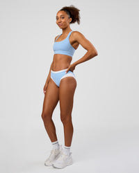 Woman wearing Turbo Track Brief in Open Air-White | Model:Txai | Size:XS