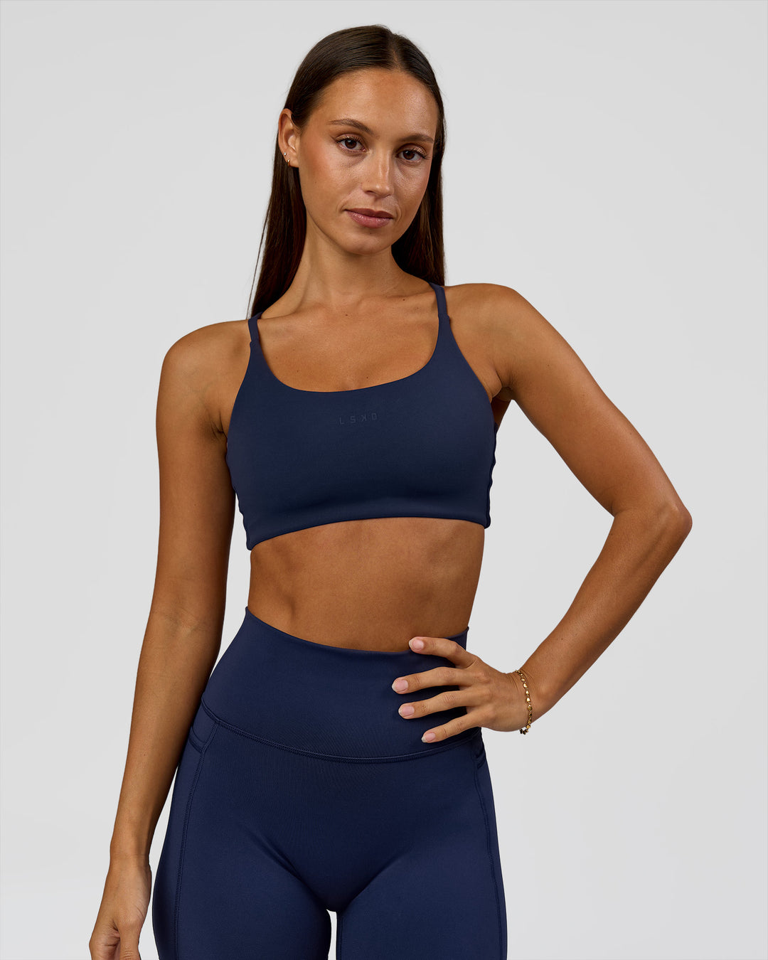 Woman wearing Twist Sports Bra - Future Navy | Model:Brylee | Size:XS