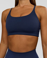 Woman wearing Twist Sports Bra - Future Navy | Model:Brylee | Size:XS