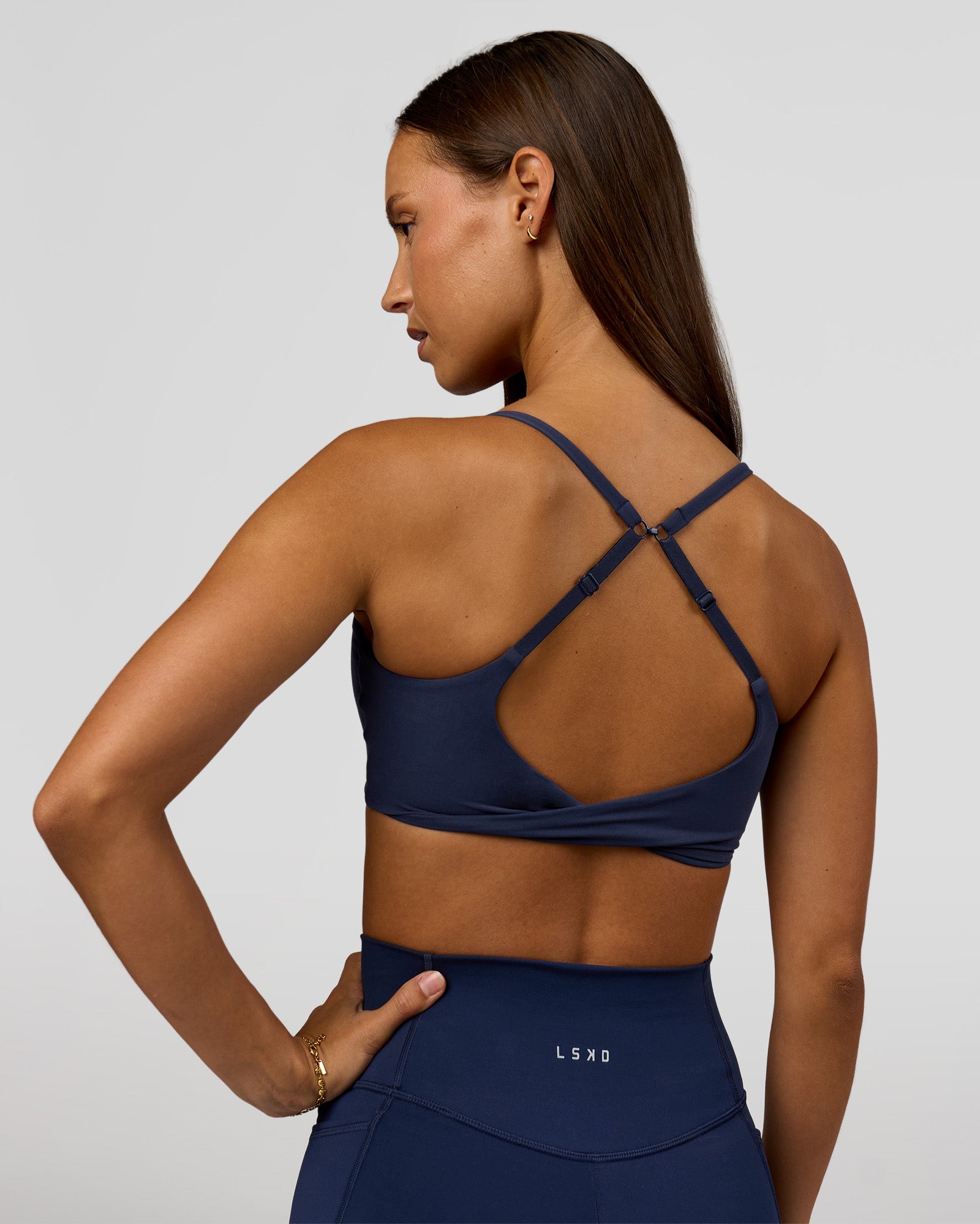Woman wearing Twist Sports Bra - Future Navy | Model:Brylee | Size:XS