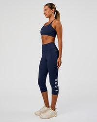 Woman wearing Twist Sports Bra - Future Navy | Model:Charli | Size:XS