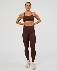 Woman wearing Twist Sports Bra - Hot Chocolate | Model:Maja | Size:XS