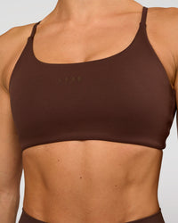 Woman wearing Twist Sports Bra - Hot Chocolate | Model:Maja | Size:XS