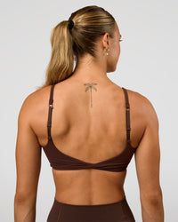Woman wearing Twist Sports Bra - Hot Chocolate | Model:Maja | Size:XS