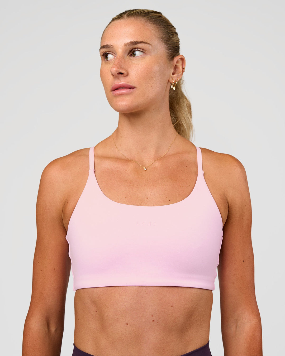 Woman wearing Twist Sports Bra - Marshmallow | Model:Emelia | Size:XS