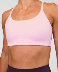 Woman wearing Twist Sports Bra - Marshmallow | Model:Emelia | Size:XS